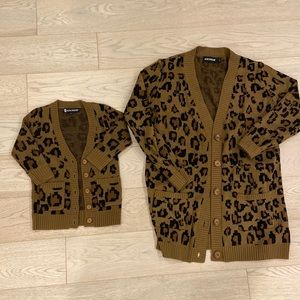 Mama and baby matching sweaters.